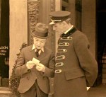 Harry shows the doorman a tiny photo of Mary
