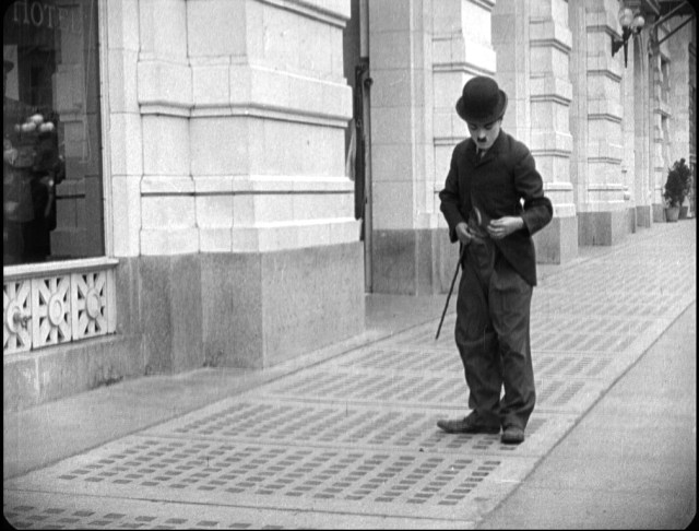 [Here's a frame grab from the new Blu-ray release.  You can see a man at the far left watching Chaplin.]