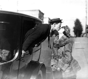 The Alvarado Arms stands behind Buster.
