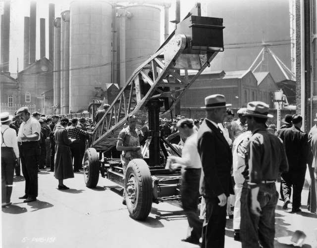 The Chaplin crew at work filming Modern Times near the corner of Ramirez and Howard (note the street sign at back).