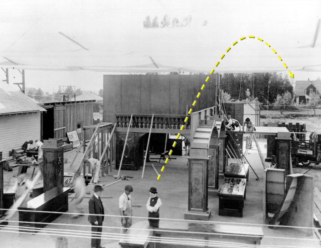 looms at back as Chaplin surveys construction of the department store set for his first Mutual production The Floorwalker (1916). 